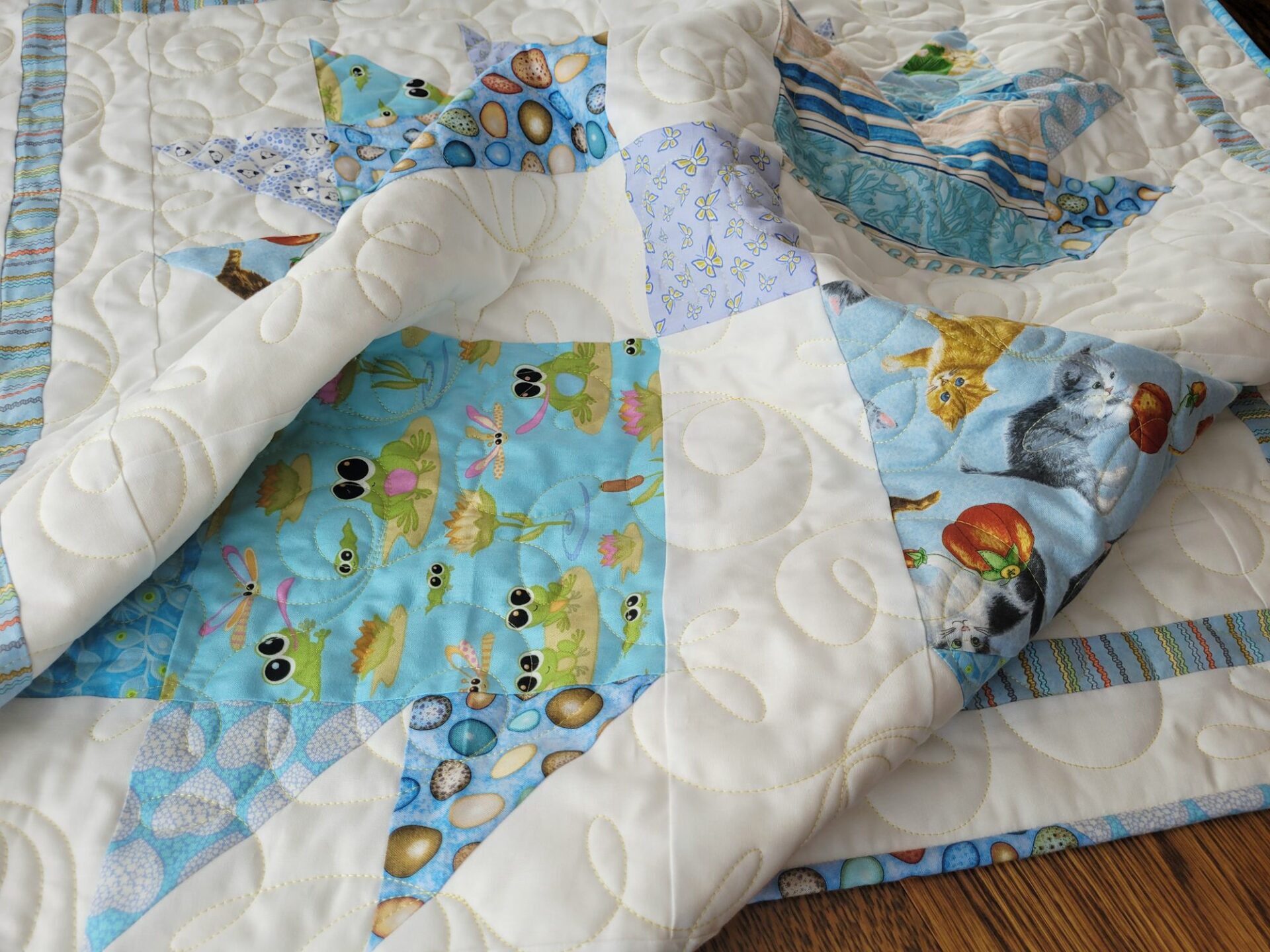 baby quilt with animal prints and soft minky back