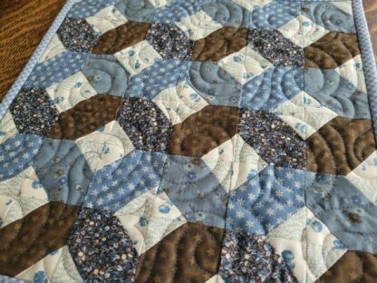 patchwork mini quilt in blue and brown