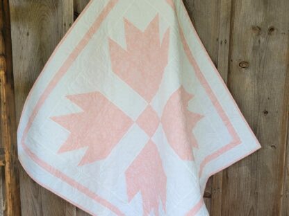 pink and white baby quilt