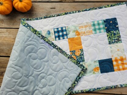 showing back of quilted table runner