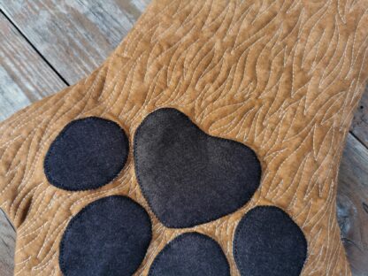 close up view of pet paw stocking showing quilted fur texture