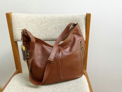 Chocolate brown and tan glove tanned leather Hobo bag for women.